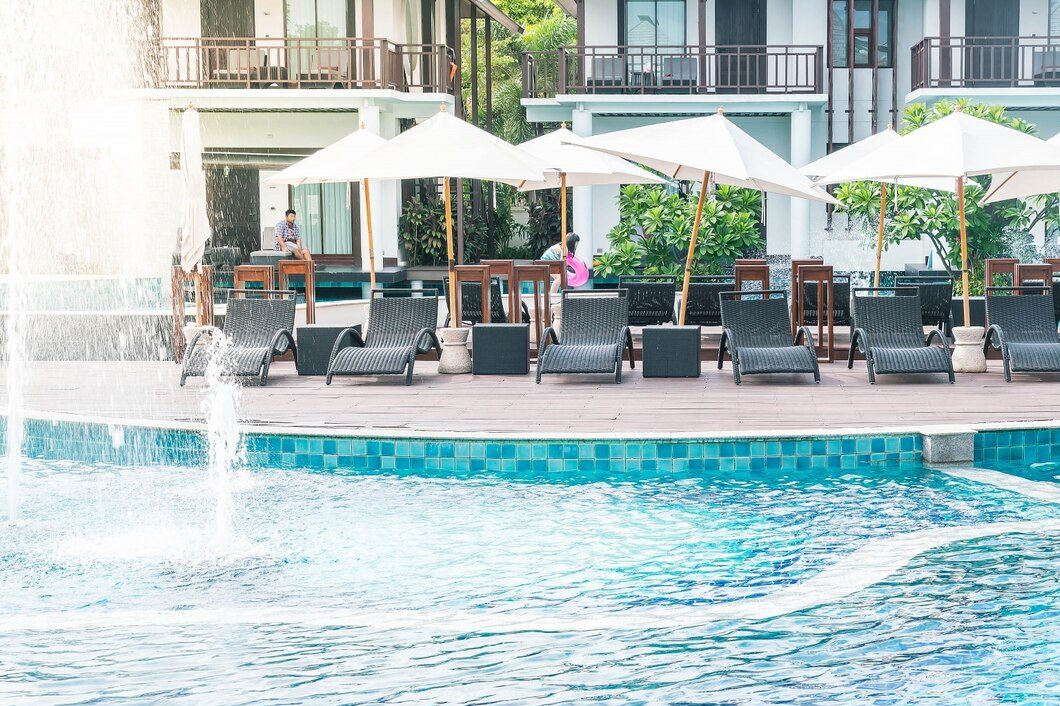 beautiful-luxury-hotel-swimming-pool-resort-with-umbrella-chair beautiful-luxury-hotel-swimming-pool-resort-with-umbrella-chair