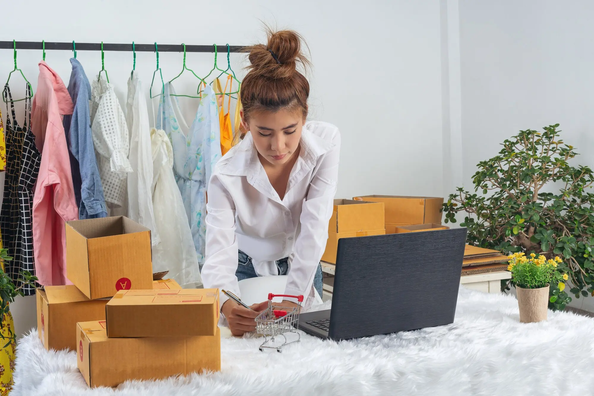 A business woman is working online and traing to reply customer at home office packaging on wall